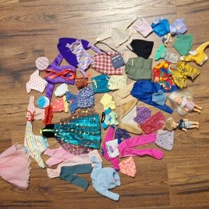 LOT of Barbie, Ken and Little Clothes Plus A Little Boy And Girl Dolls..51 Pcs